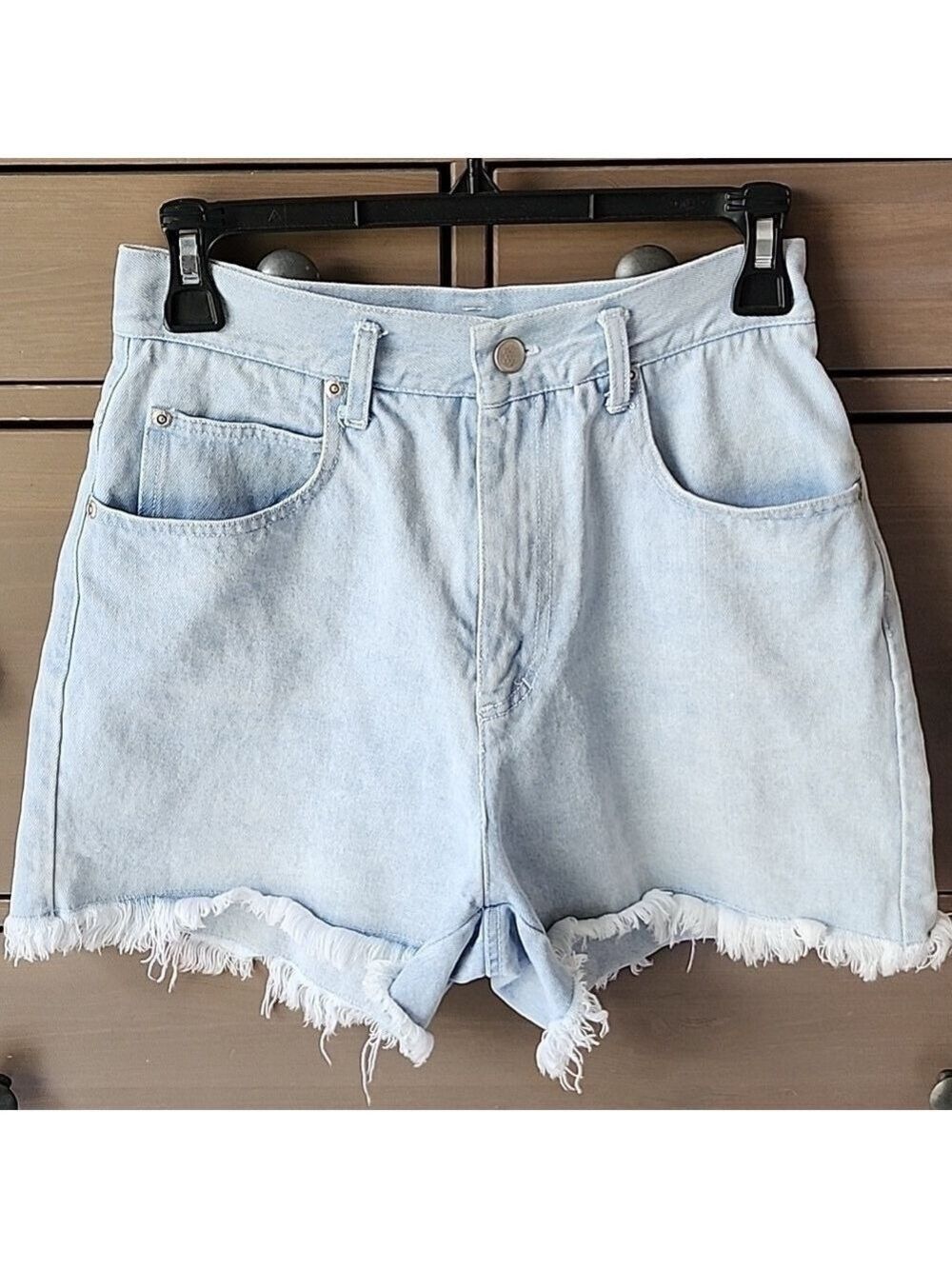 LIGHT WASH DENIM SHORTS WITH A FRAYED HEM SIZE 5 / 6